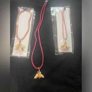Beaded necklaces w/ seashell pendants